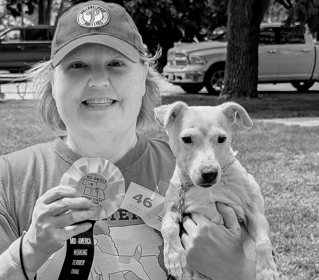 Ginger holding Kali in her right hand and a ribbon in her left hand. 