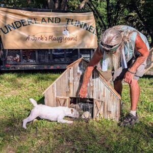 A man with a dog at the entry to the underland tunnel